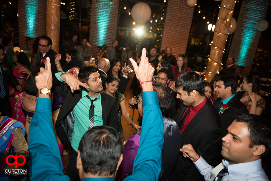 Bride's family dancing at her wedding reception.