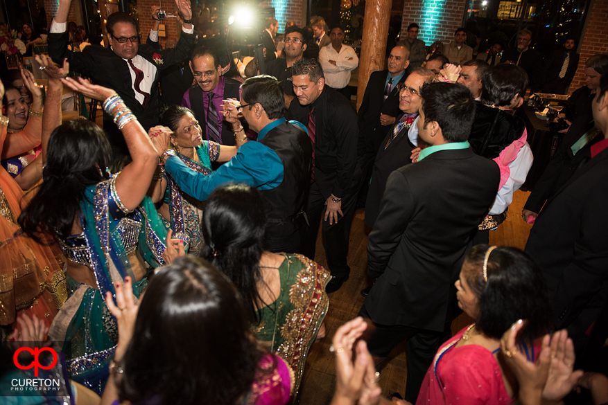 Bride's parents dancing at her Indian wedding reception.