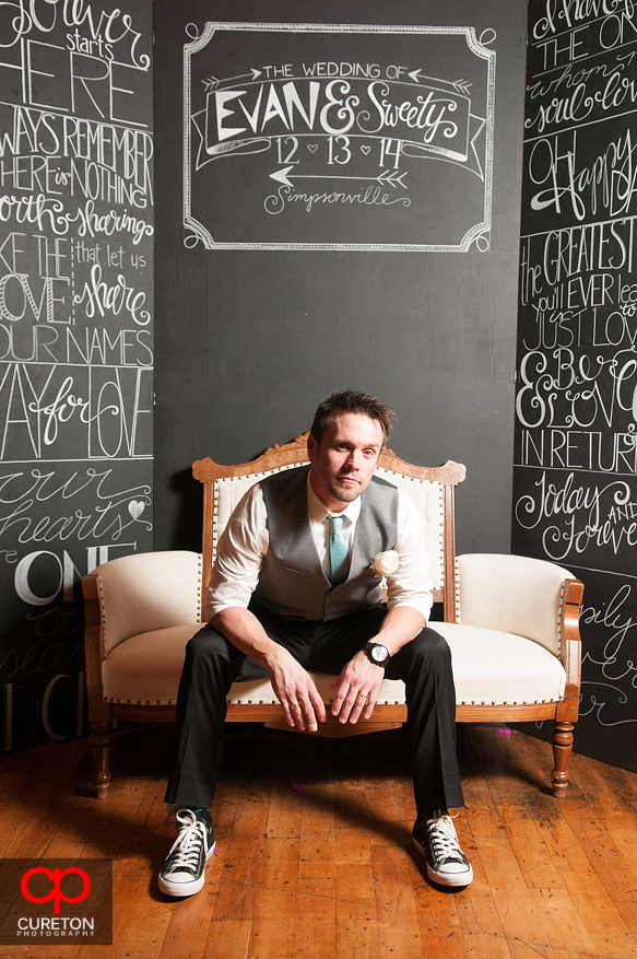 Groom poses at the Photo Booth.