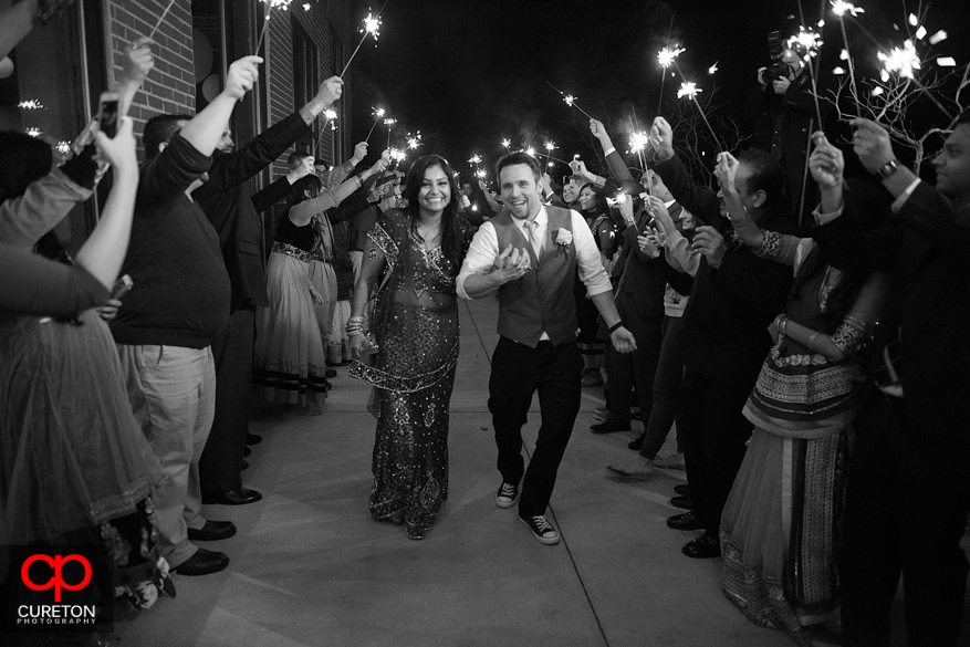 Bride and Groom making a sparkler exit at The Loom in Simpsonville.