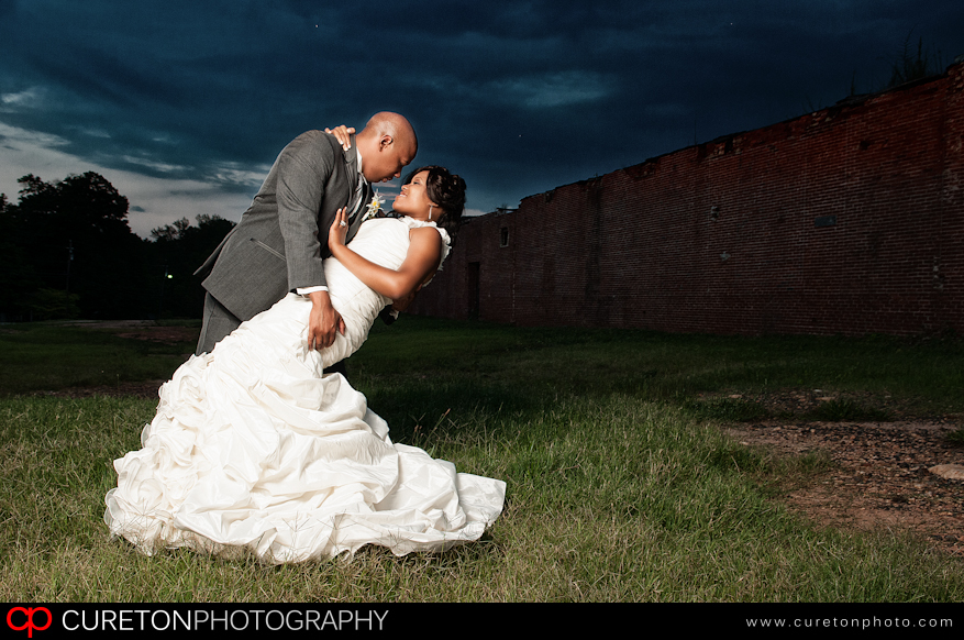 Groom and Bride doing the dip outside of The Loom in Simpsonville,SC.