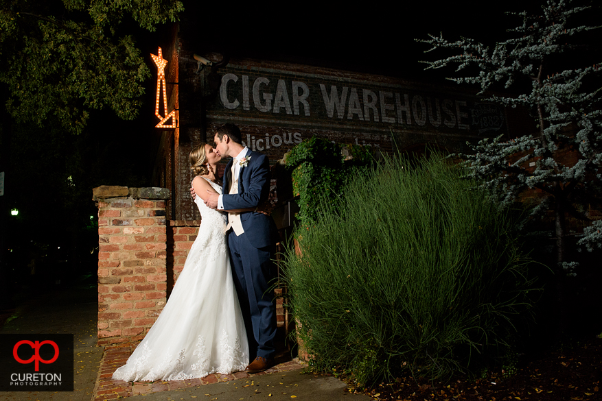Epic photo of bride and groom after their Old Cigar Warehouse wedding reception in downtown Greenville,SC.