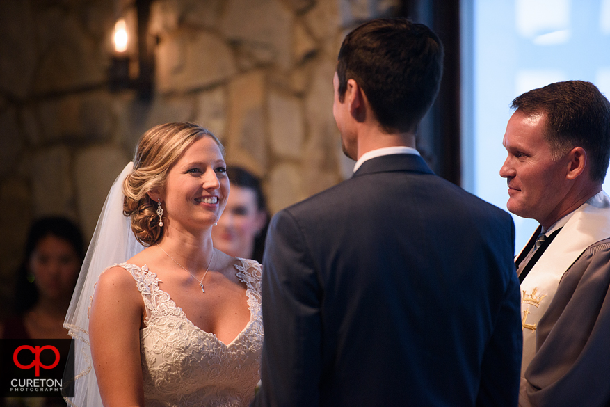 Bride looks at groom during their Glassy Chapel wedding.