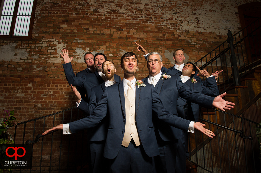 The groomsmen on the stairs at the Old Cigar Warehouse.