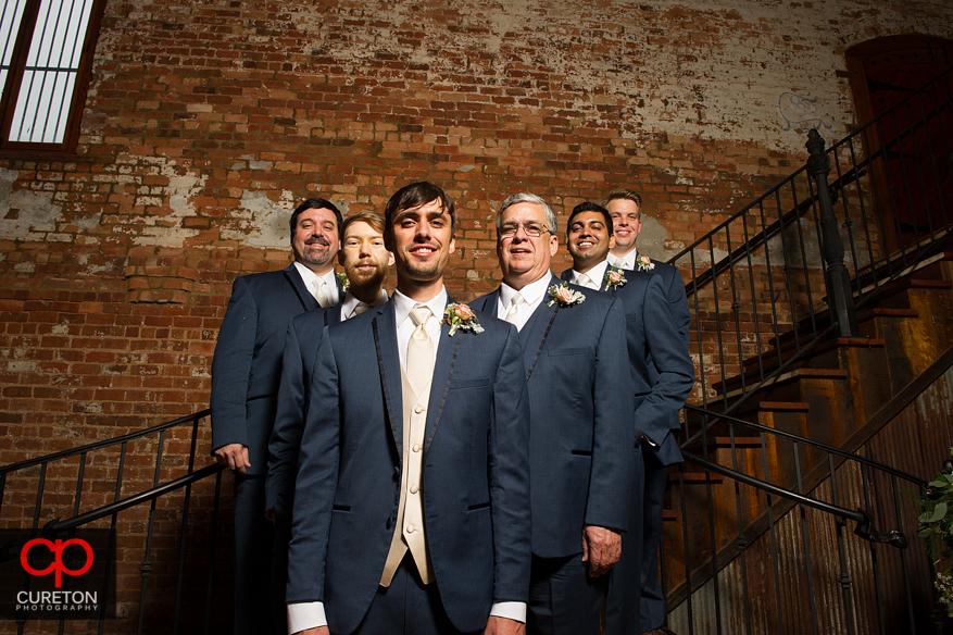 The groomsmen on the stairs at the Old Cigar Warehouse.