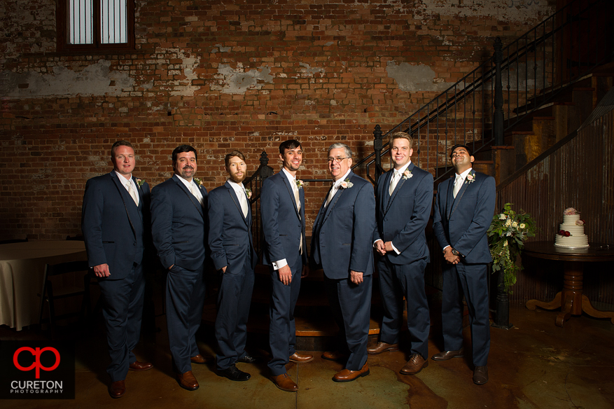 The groomsmen on the stairs at the Old Cigar Warehouse.