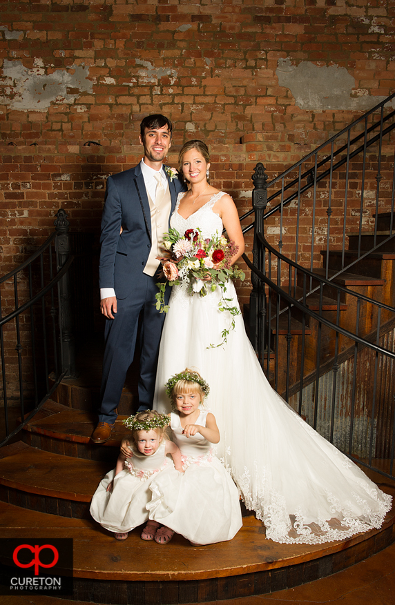 The bride and groom and their flower girls.