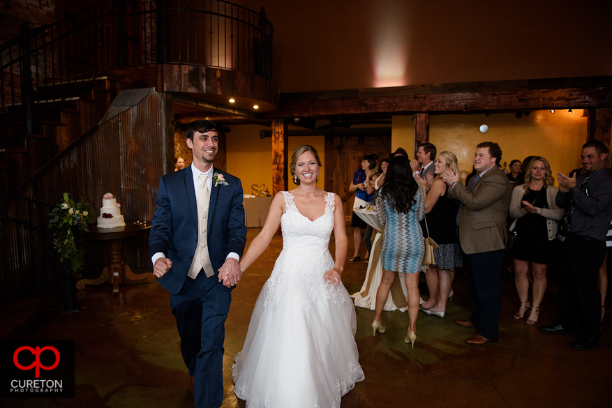 The bride and groom are introduced.