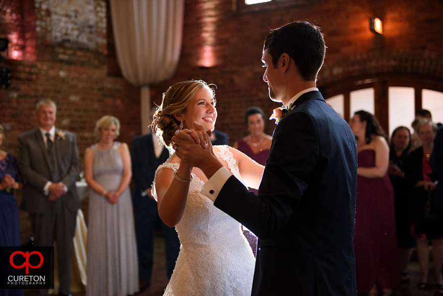 Bride and groom have a first dance at the Old Cigar Warehouse.