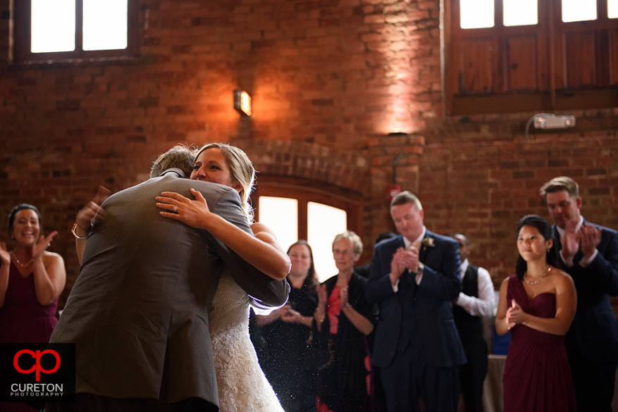 Birde hugging her father after dancing.