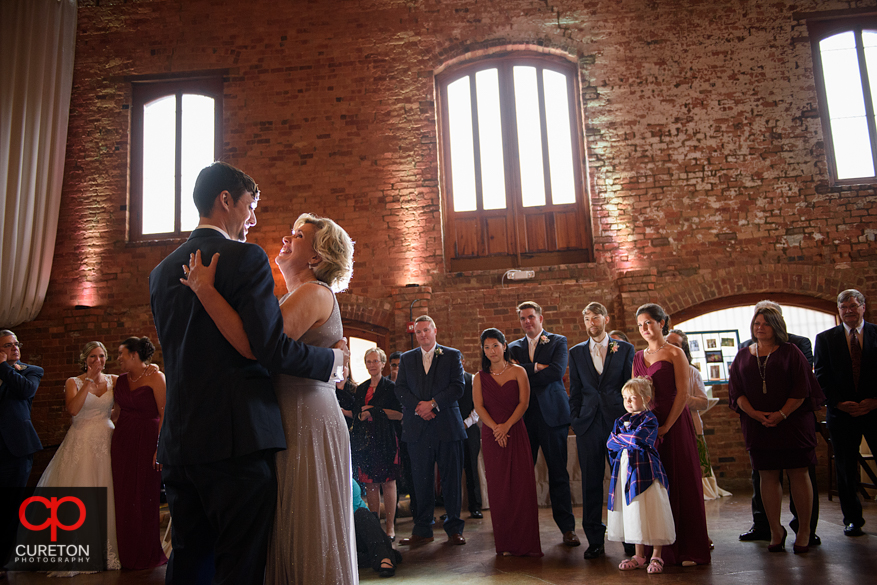 Groom dancing with his mother.