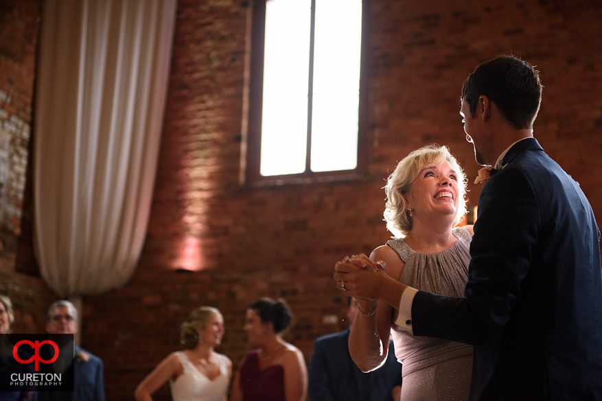 Groom dancing with his mother.