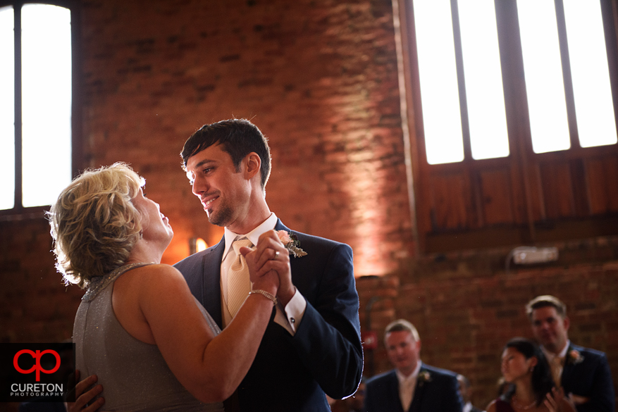 Groom dancing with his mother.