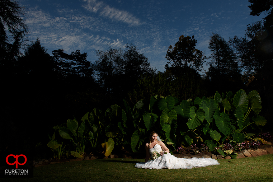 Bride on the ground during a Rock Quarry Garden bridal in downtown Greenville,SC.