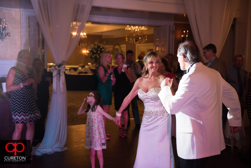 Groom and bride dancing.