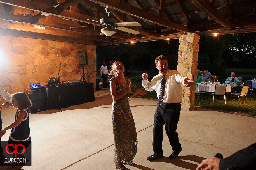 Guest having fun dancing at the Timberock at Hopkins Farm wedding reception.