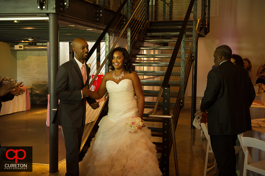 Bride and Groom entering the reception.