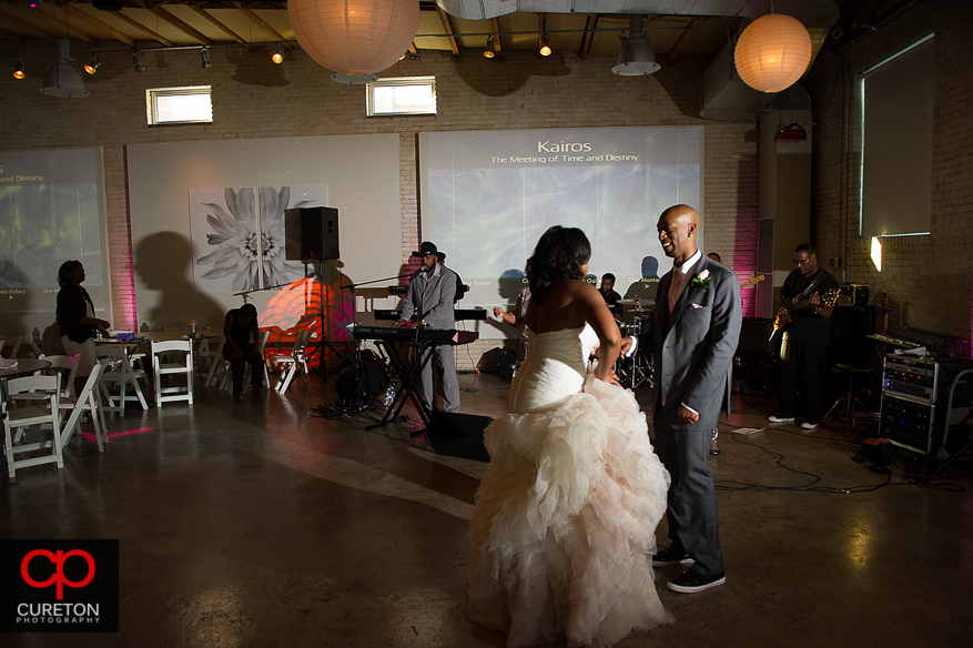 Bride and groom dancing.