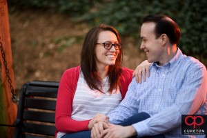 Couple sitting on a park bench.
