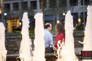 Couple during an engagement session along the Reedy River.