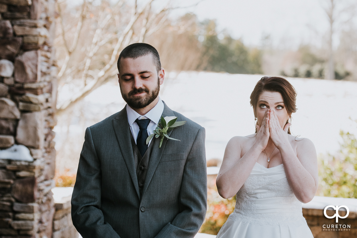 Bride getting emotional during her first look with her groom before the ceremony.