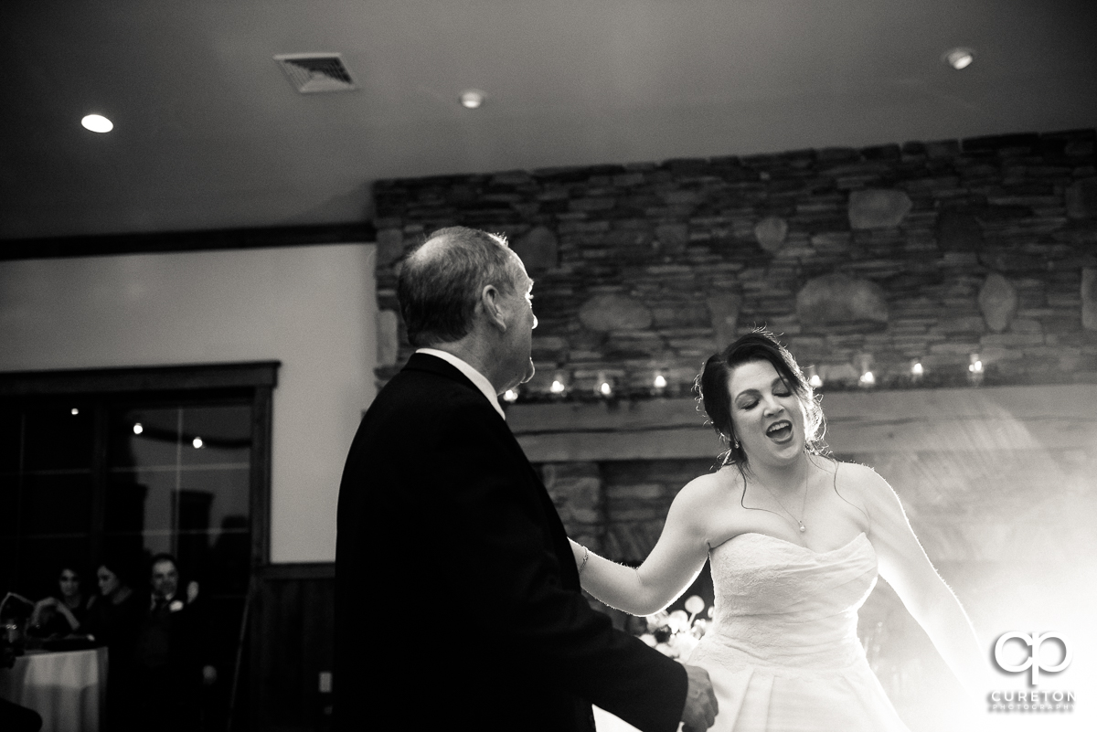 Bride and her dad dancing.