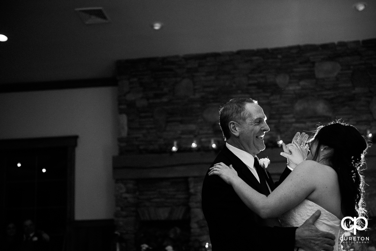 Bride and father dancing.