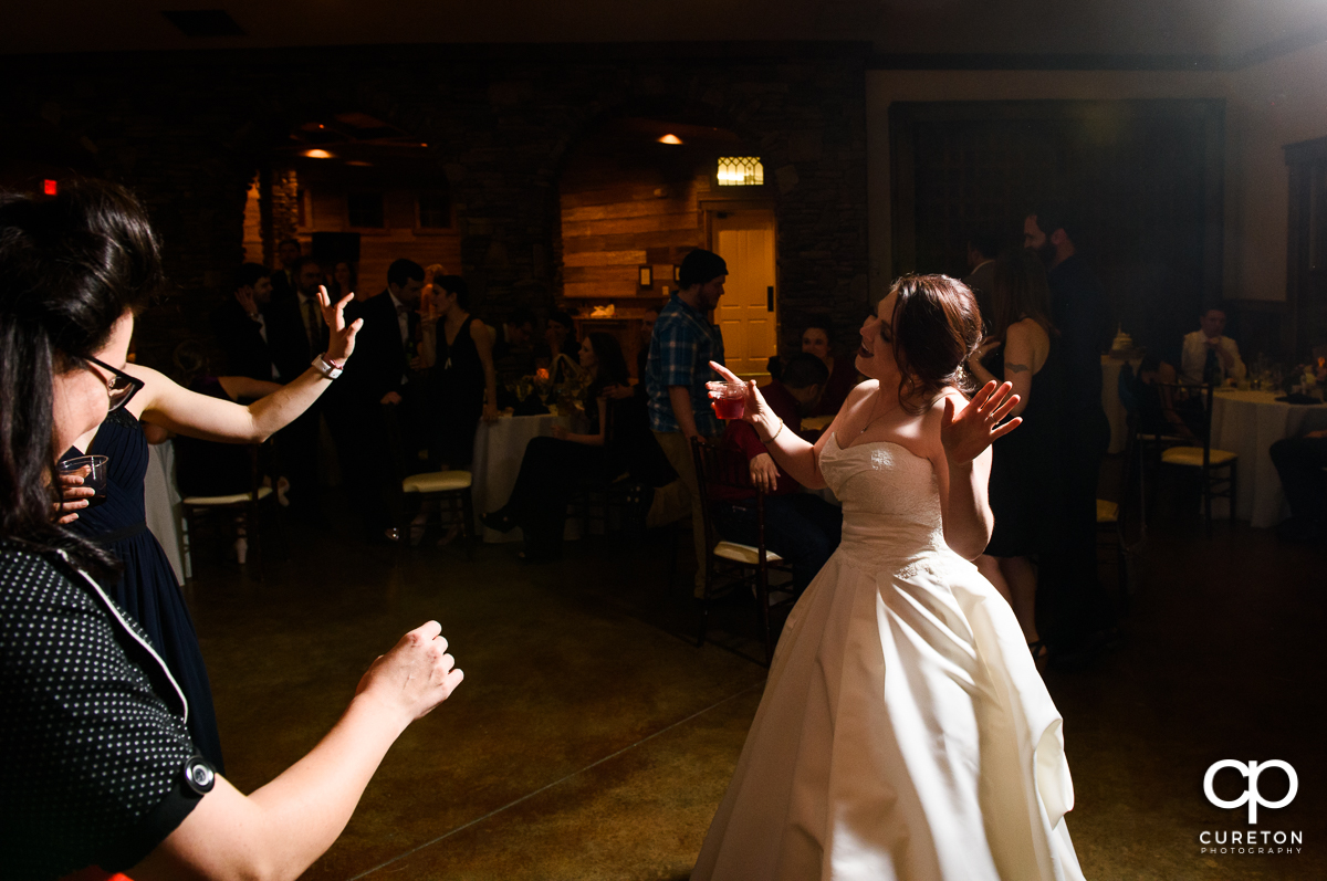 Guests dancing at the wedding reception.