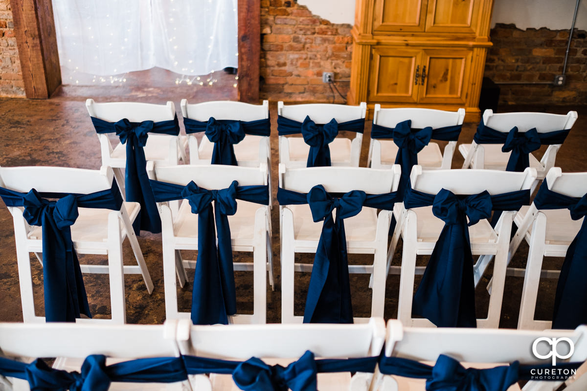 Bows on chairs at the wedding ceremony.