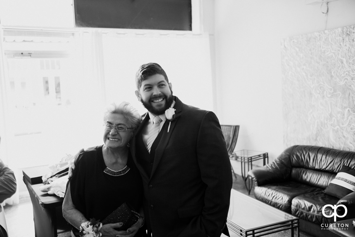 Groom sharing a moment with his grandmother.