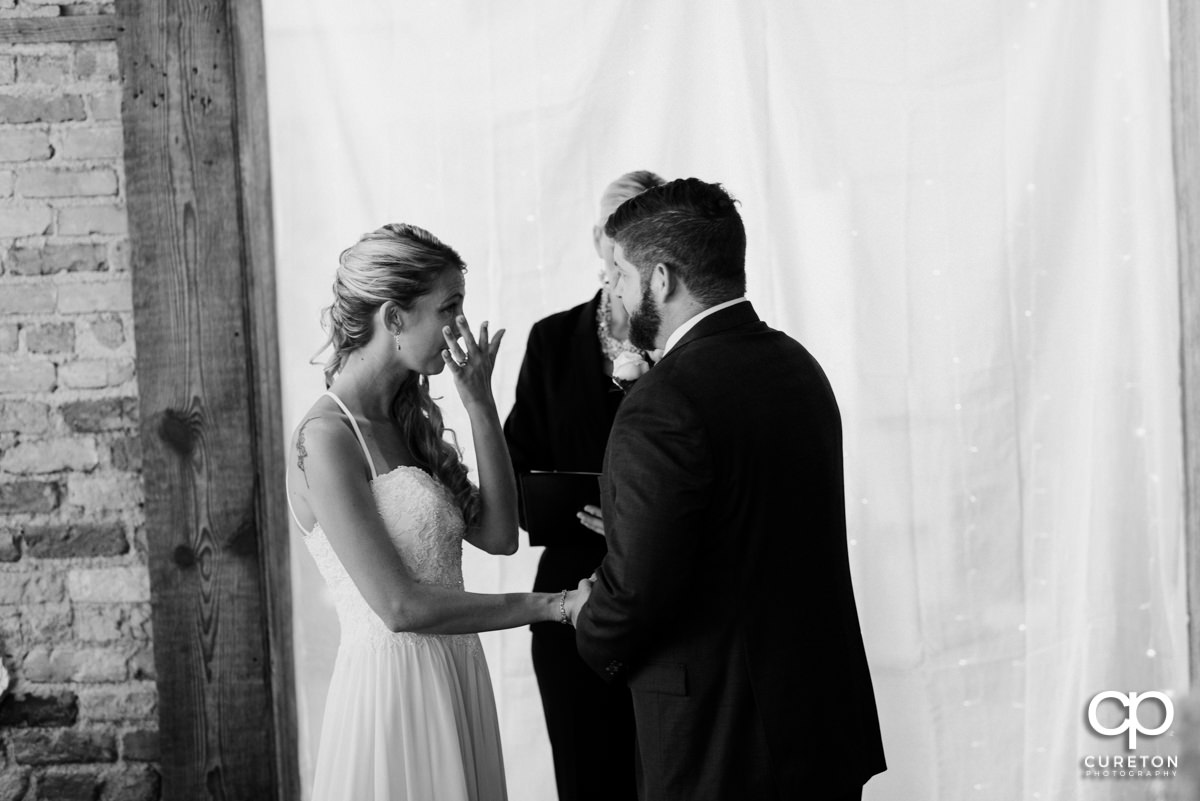 Bride crying at her wedding ceremony at Artisan Traders.