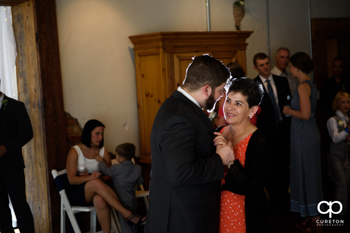 Groom dancing with his mother.