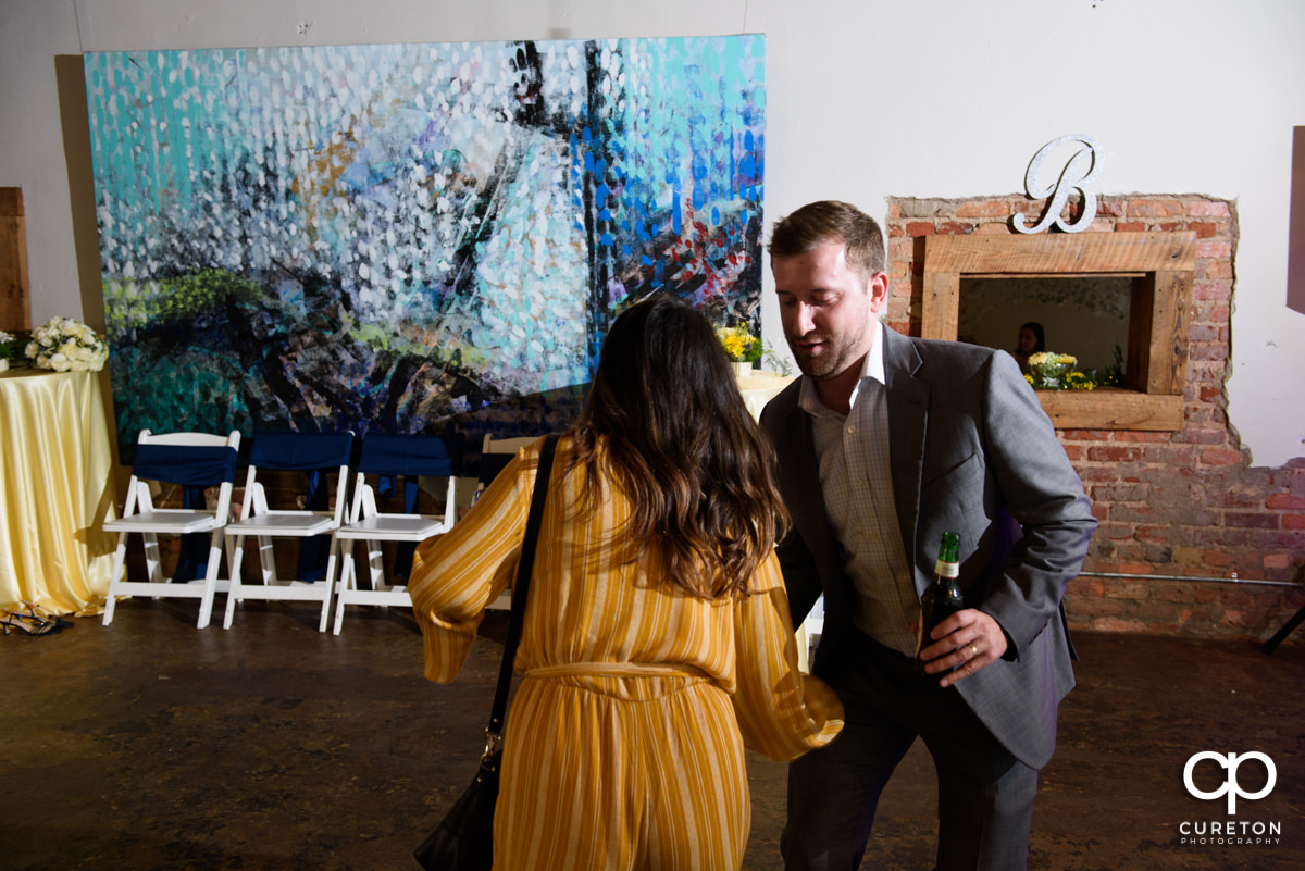 Wedding reception guests dancing at Artisan Traders.