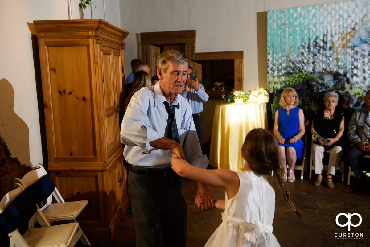 Wedding reception guests dancing at Artisan Traders.