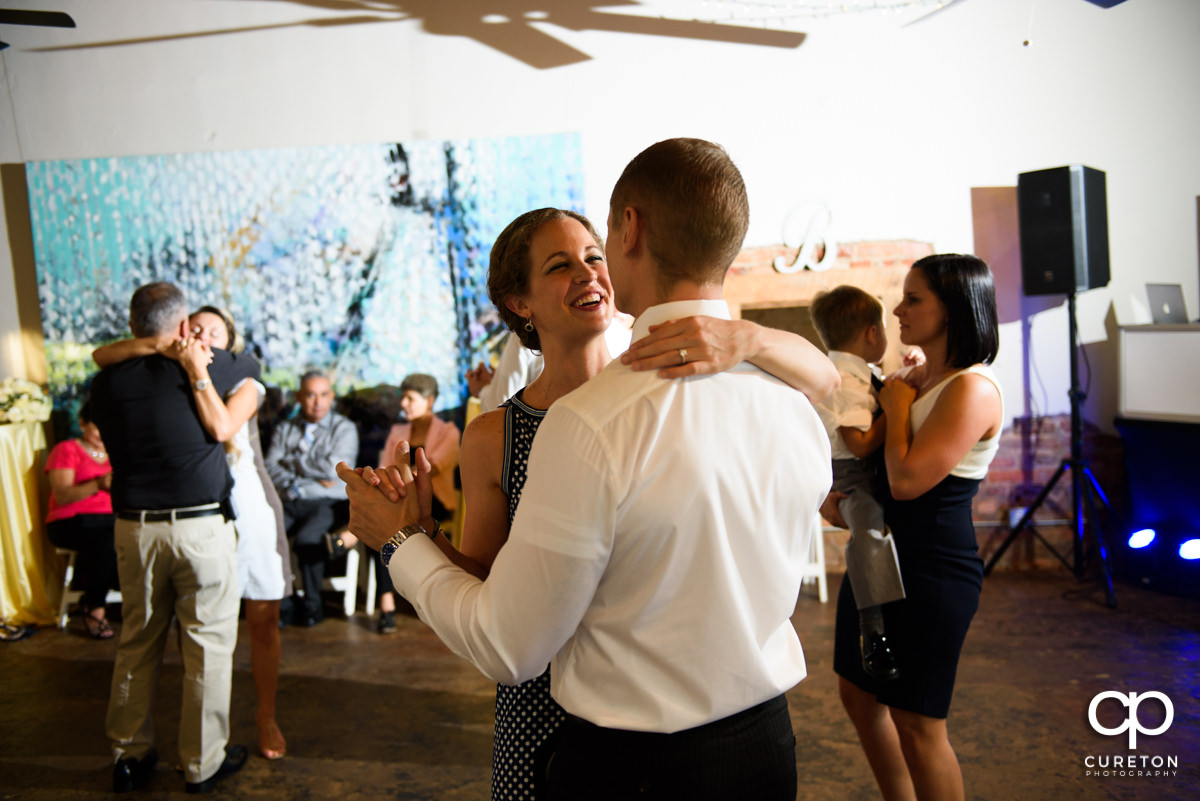 Wedding reception guests dancing at Artisan Traders.