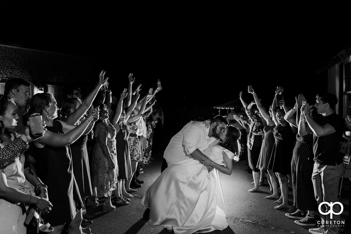 Groom and bride making a grand exit.