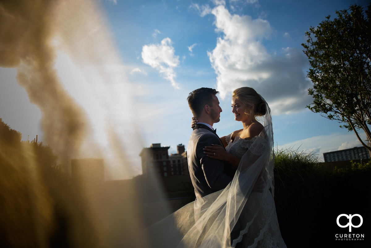 Bride and groom on a rooftop after their wedding at Avenue in Greenville,SC.