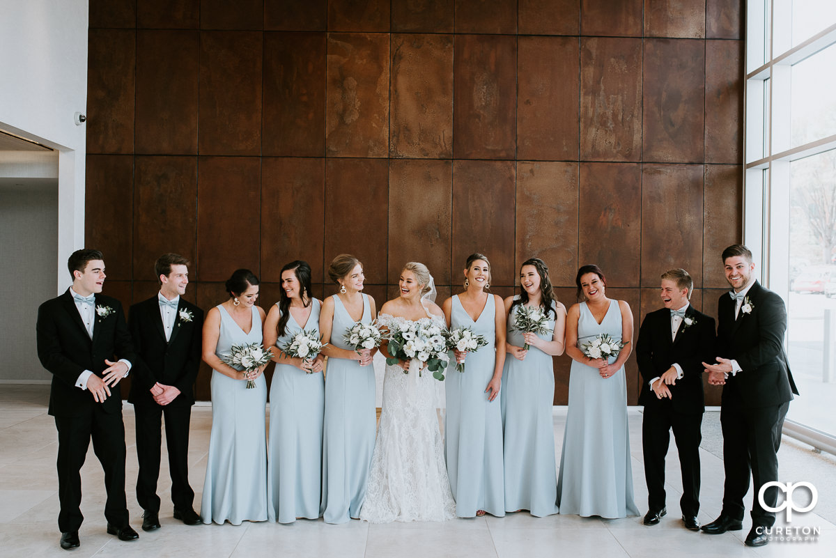 Bride and bridesmaids talking in the lobby at Avenue.