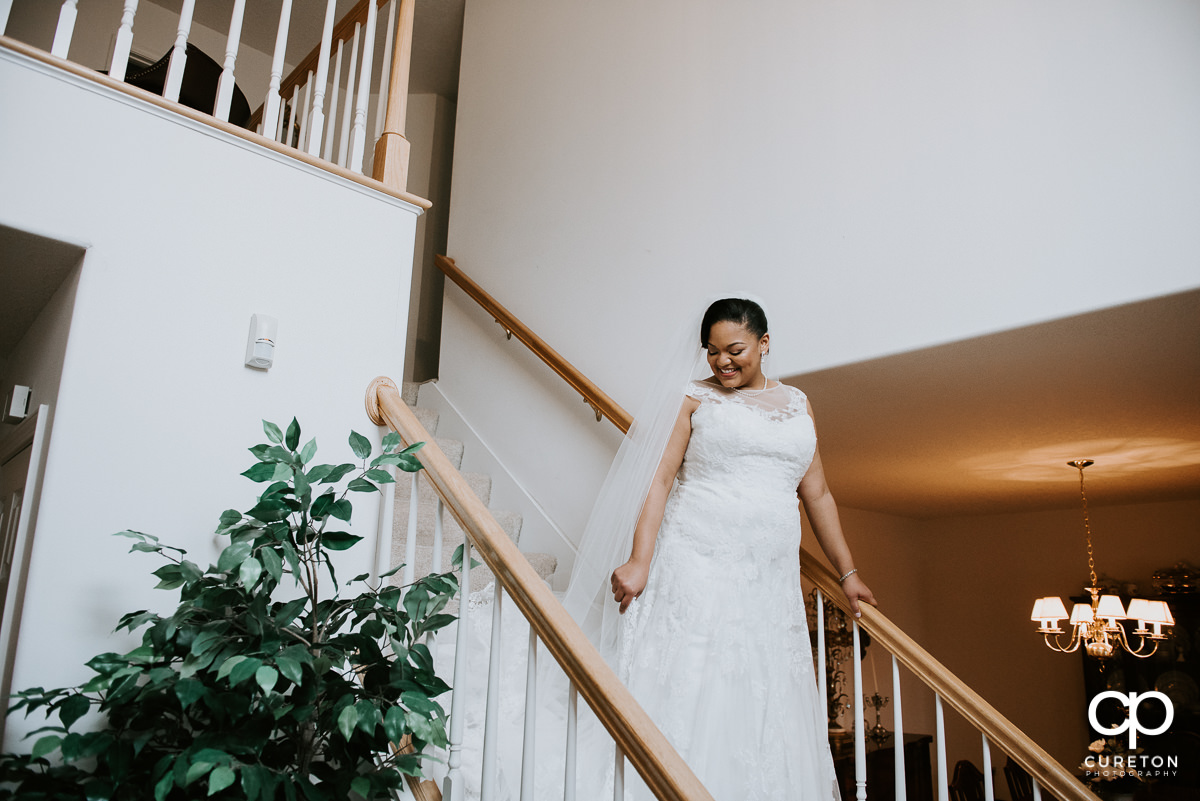 Bride on the staircase at her mother's house.