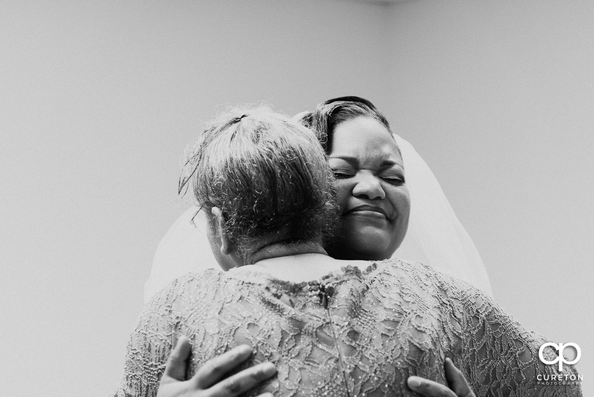 Bride and her grandmother hugging before the ceremony.