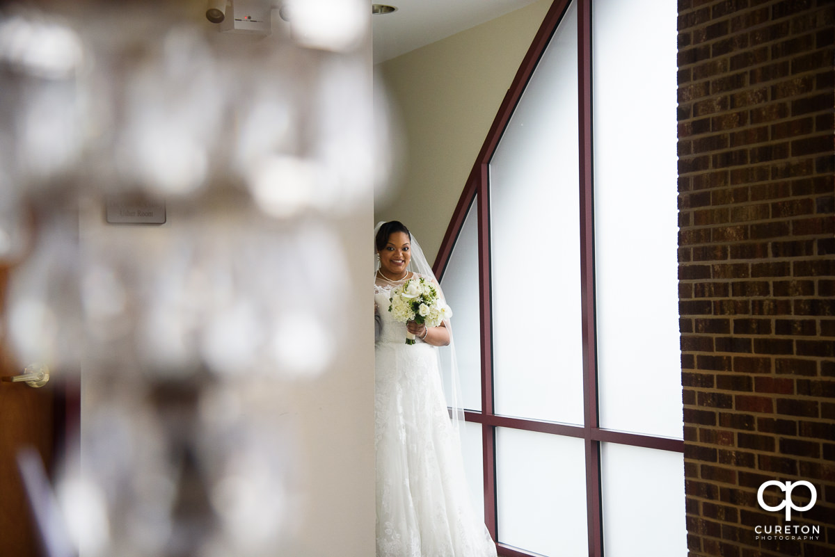 Bride getting ready to walk down the aisle at her wedding ceremony.