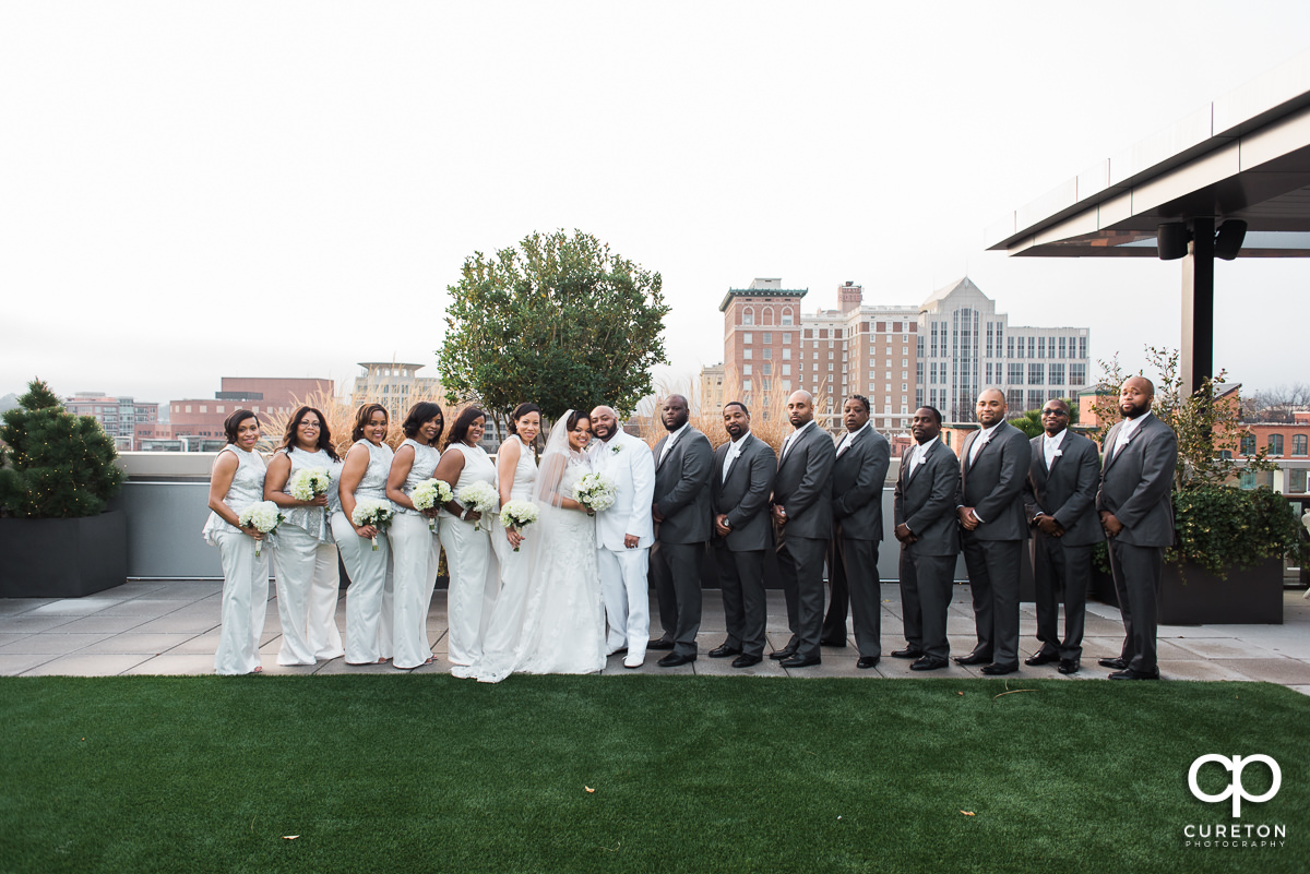 Wedding party on the rooftop facing the downtown Greenville,SC skyline.