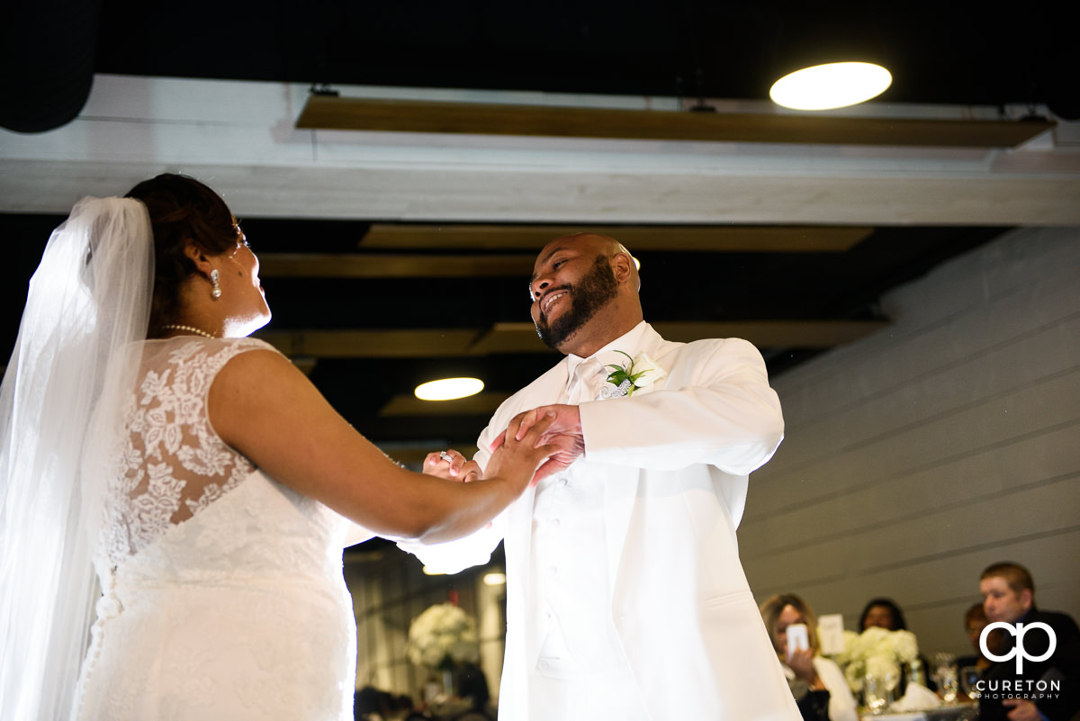 Groom smiling during the first dance.