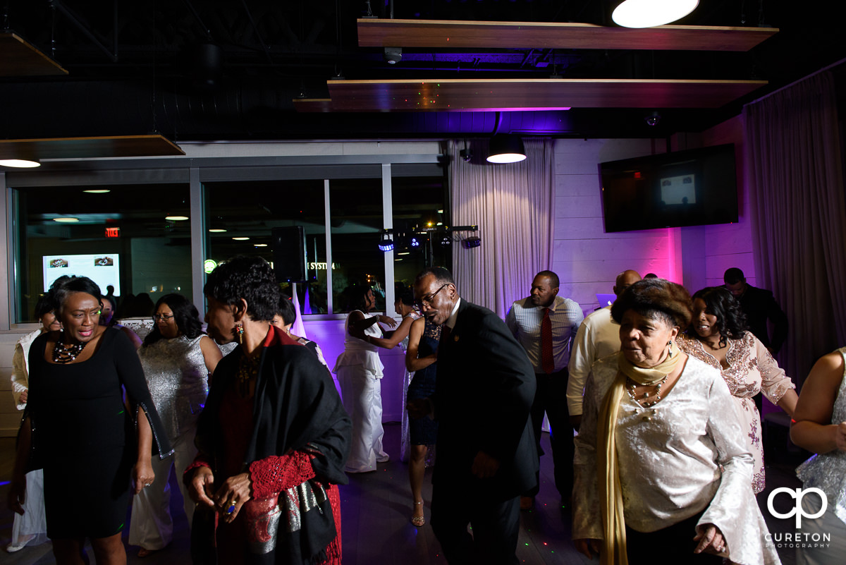 Wedding guests dancing at the reception at Avenue.