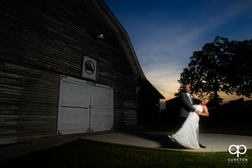 Bride and Groom dancing at sunset after their wedding at The Barn at Forevermore Farms.