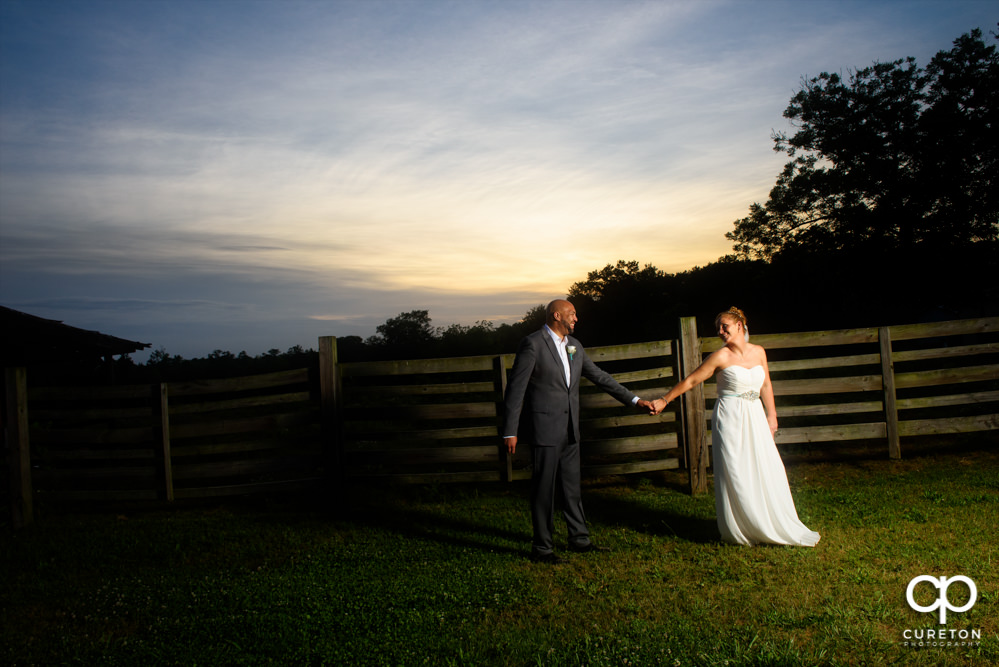 Bride and groom at sunset after their wedding at The Barn at Forevermore Farms.