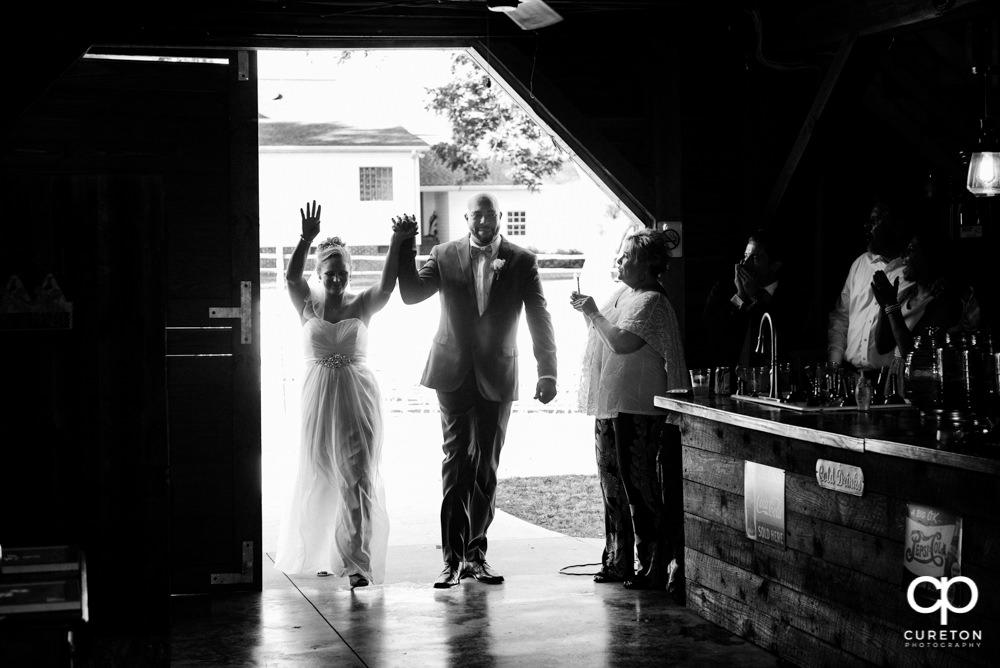 Bride and groom making an entrance.