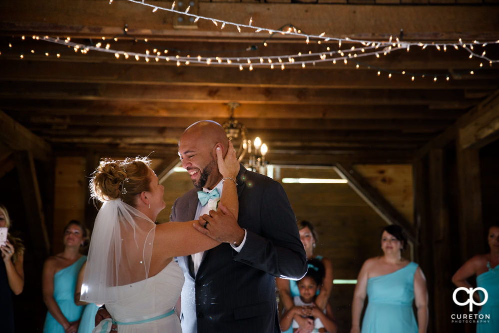 Bride and groom first dance at their wedding reception at The Barn at Forevermore Farms.