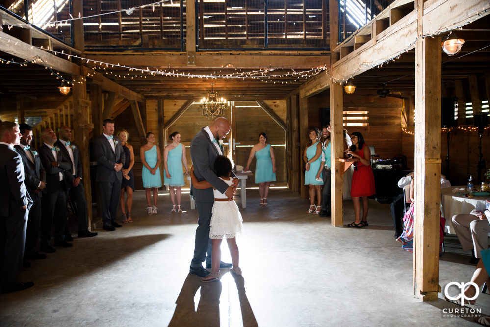 Groom dancing with his daughter at the wedding reception at The Barn at Forevermore Farms.