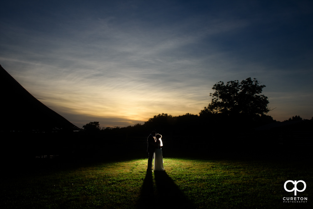 Sunset silhouette of the bride and groom.